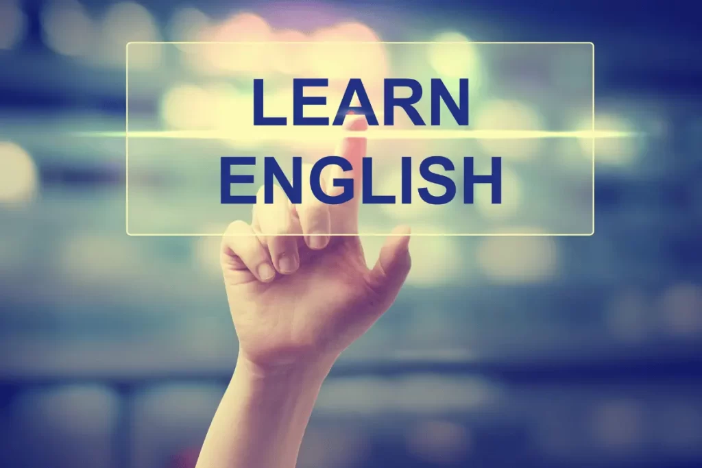 una mano indica la scritta "Learn English"